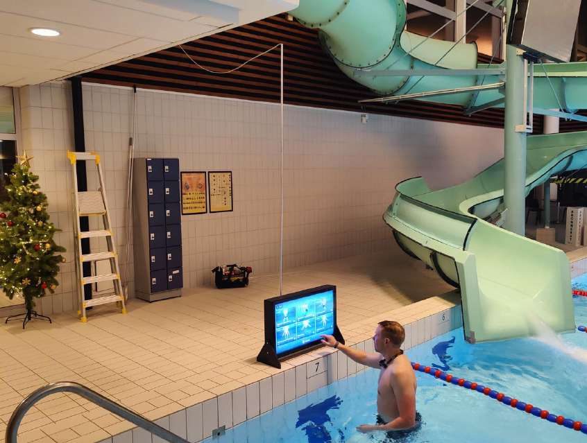 Waterbic aqua aerobics screen at the poolside of a swimming pool