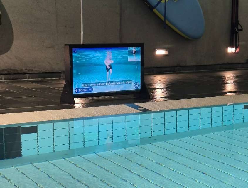 Waterbic aqua aerobics screen at the poolside of a swimming pool