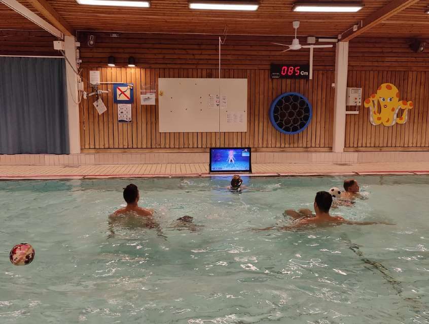 Waterbic aqua aerobics screen at the poolside of a swimming pool