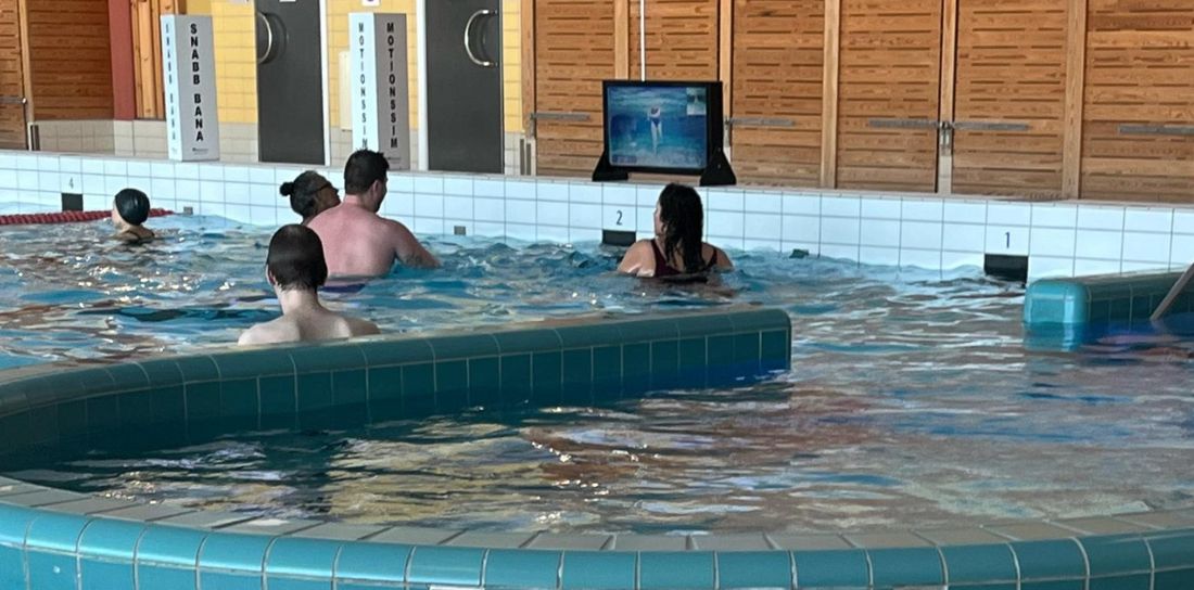 Waterbic aqua aerobics screen at the poolside of a swimming pool